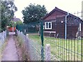 SZ0696 : Kinson: footpath E21 passes the Scout hut by Chris Downer