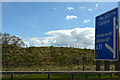 NS7748 : South Lanarkshire : The M74 Motorway - Roadside by Lewis Clarke