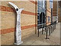 TL1999 : Cycle route marker and stands outside Peterborough library by Stephen Craven