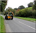 SH7400 : Hedge-trimming tractor on the A487 in Machynlleth by Jaggery