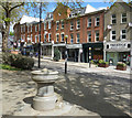 TQ2585 : Fountain and Shops, Fortune Green by Des Blenkinsopp