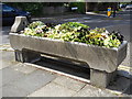 TQ3194 : Old cattle trough with flowers on The Green, Winchmore Hill by Paul Bryan