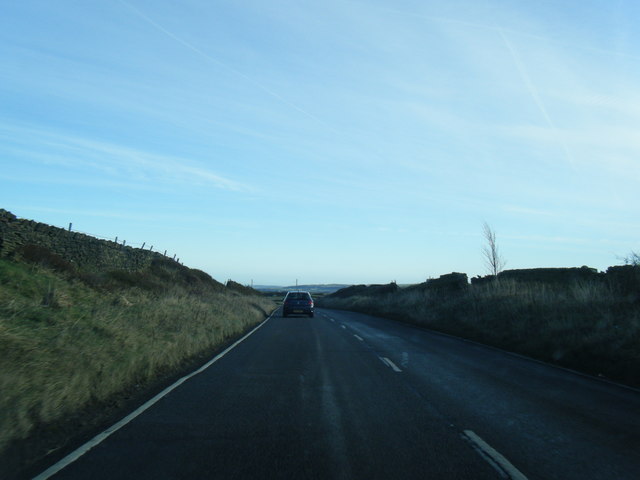 A635 and a lone tree at Knowl Height