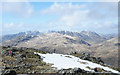 NY2801 : Rocks and snow patch on north side of Wetherlam by Trevor Littlewood