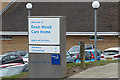 TQ3505 : Dean Wood Care Home sign by Geographer