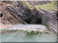 SS5747 : Cave entrance  and Rock Pool, Combe Martin, Devon by Derek Voller