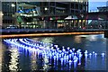 TQ3780 : View of Aether & Hemera's 'Voyage' - a flotilla installation in Heron Quay, London by J W