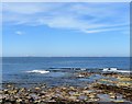 NU2132 : View out towards the Farne Islands from the harbour at Seahouses by Robert Graham