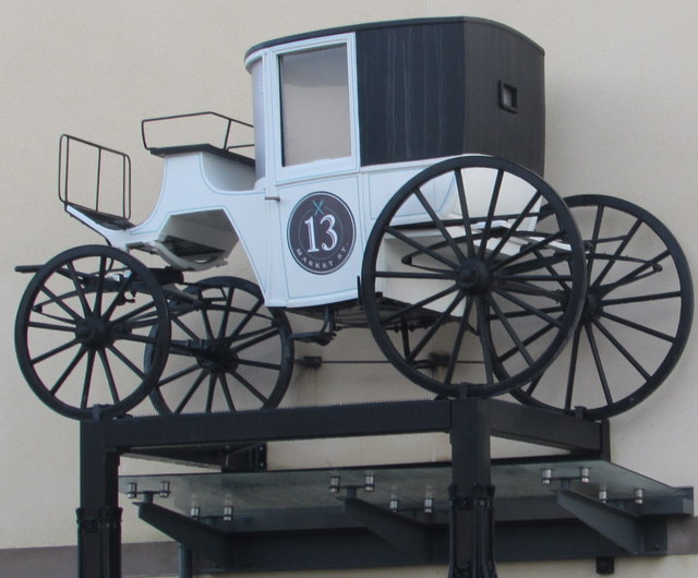 Carriage above the entrance to 13 Market Street, Caerphilly