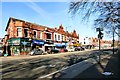 SJ8594 : Shops on Wilmslow Road by Gerald England