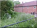 SK7331 : Canalside buildings at bridge #41 on the Grantham Canal by Graham Hogg