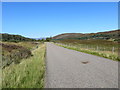 NN6790 : Minor road in Glen Truim approaching Crubenmore by Peter Wood