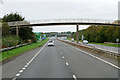 NS3335 : Northbound A78, Footbridge at Meadowhead Industrial Estate by David Dixon