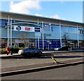 ST3486 : Names above an entrance to Tesco Extra in Newport Retail Park by Jaggery