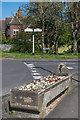 TQ2651 : Horse trough and signpost by Ian Capper