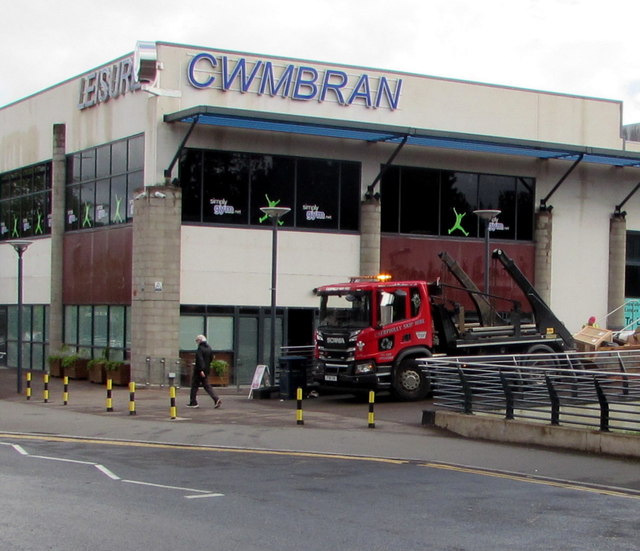 Skip and skip lorry in Cwmbran town centre