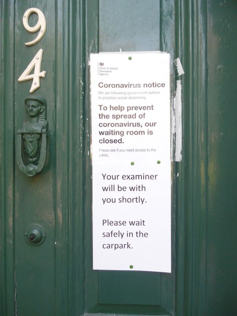 Notice on door of Driving Test Centre, Cheltenham