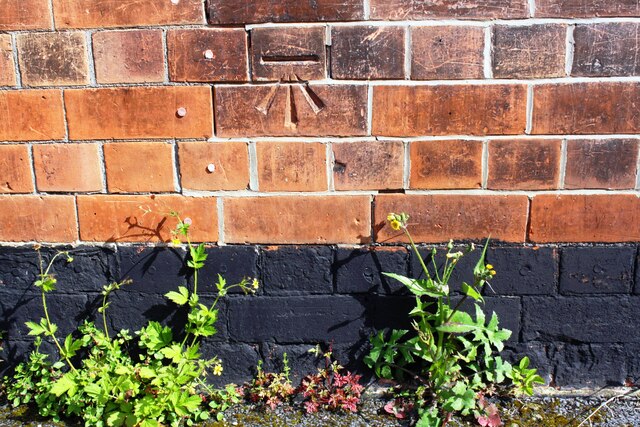 Benchmark on #34 Glapton Road (Barnsley Terrace face)