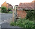 SK6826 : Stile by pavement on footpath by Andrew Tatlow