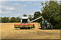 TM2155 : Harvesting wheat near Clopton Green by Simon Mortimer