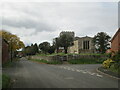 SE8943 : Main  Street  Goodmanham  and  All  Saints  Parish  Church by Martin Dawes