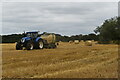 TM2652 : Baling straw near Bredfield by Simon Mortimer