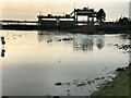 TL2799 : The swollen River Nene at Dog in a Doublet sluice - The Nene Washes by Richard Humphrey