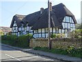 SO9944 : Thatched timber-framed cottage by Philip Halling