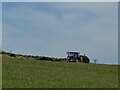 SE0224 : Muck spreading above Moor Bottom Lane by Stephen Craven