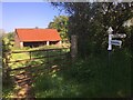 ST1235 : Barn and SCC fingerpost near Leigh Wood railway crossing by Marika Reinholds