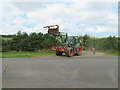 NT7563 : Tractor and hay tedder in the Lammermuir Hills by M J Richardson