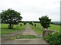 NZ1446 : Farm entrance road by Robert Graham