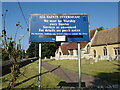 TL4958 : All Saints Church sign by Geographer