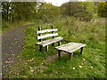 NS5579 : Seat and table beside the Old railway line by Richard Sutcliffe