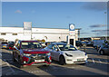 NZ1927 : Car park with electric vehicle charging point by Trevor Littlewood