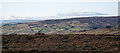 NZ0125 : Tractor on moorland of Grey Carrs by Trevor Littlewood