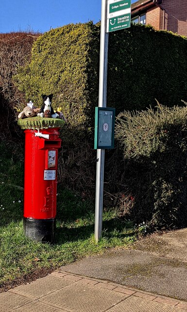 Colourful hat on a pillarbox, Ty Canol Way, Cwmbran