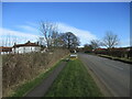 SE9470 : Helperthorpe  name  sign  with  West  Farm  to  left by Martin Dawes