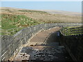 SD9916 : Dry outflow channel, Green Withens reservoir by Christine Johnstone