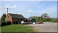 SO8496 : Barn and sheds by Furnace Grange Farm near Trescott by Roger  D Kidd