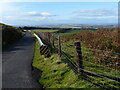 NT6168 : Crash barriers at roadside close to White Castle Fort by Ruth Sharville