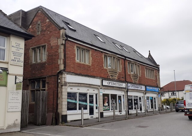 Shops with flats above on Grosvenor House at Harrogate Road / Street Lane junction