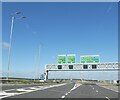 TL2069 : Gantry over A14 at exit for A1 near Brampton by David Smith