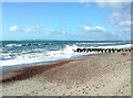 SZ1690 : A stone groyne near Hegistbury Head looking west to the Jurassic Coast by Rod Grealish