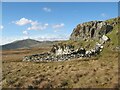 SH7247 : Sheepfold and crag by Jonathan Wilkins