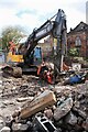 NS5574 : Excavator and rubble, Strathblane Road by Richard Sutcliffe