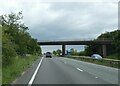 SP6978 : Road north-east of Naseby crossing A14 by David Smith