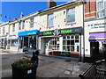 SX9265 : Mews entrance, café, bike shop, bakery in St Marychurch Precinct by David Hawgood