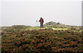 T0475 : Hill walker at summit area of Garryhoe by Trevor Littlewood