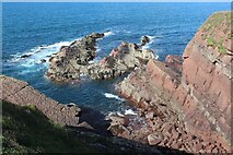  : Rocky islets below cliffs by M J Roscoe